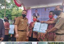 Bupati Pesawaran Dendi Ramadhona Menyerahkan Data Kependudukan Umat Kristiani